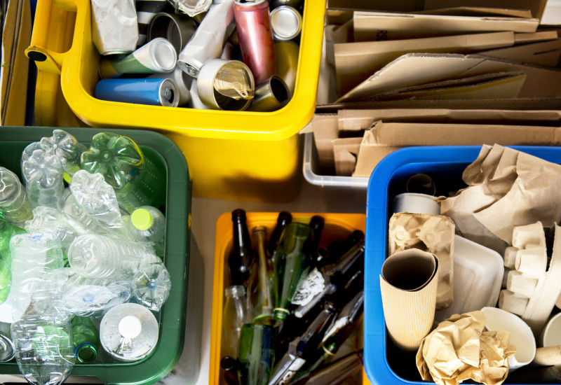 Separated packaging in the household, collected in boxes. Glass, cardboard, plastic, etc.